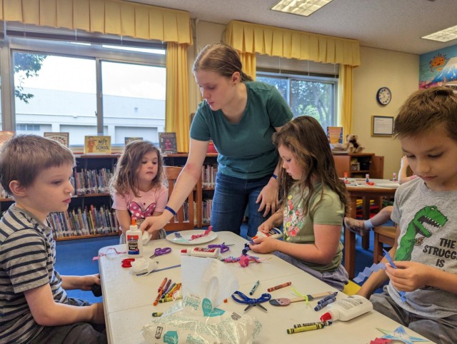 Maribel Sikes leads a crafts session in the library at Camp Zama, Japan.