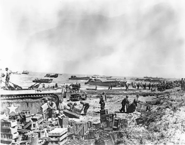 A landing craft pushing toward shore as US troops unloaded supplies at Yellow Beach in the Lingayen Gulf to reinforce American invasion forces in the Philippines in January 1945.