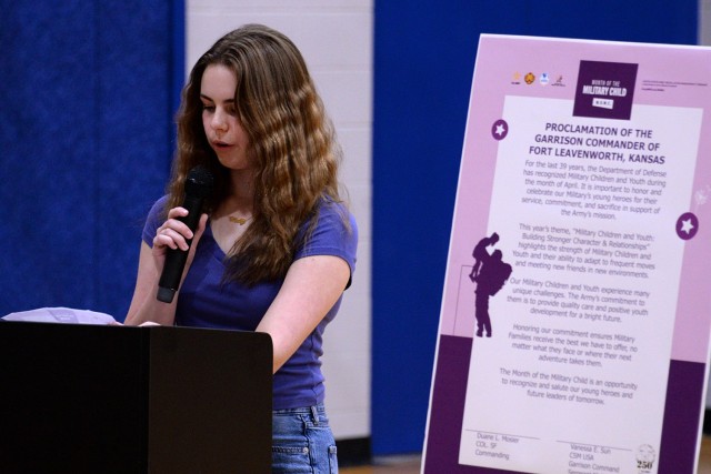 Fourteen-year-old Maddy Genge, eighth-grader at Patton Junior High School, reads aloud the Month of the Military Child proclamation during the MOMC kickoff ceremony April 1, 2025, at Harrold Youth Center at Fort Leavenworth, Kansas. Photo by...