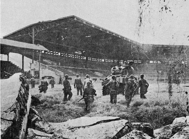 American cavalrymen entering the Rizal stadium and ammo dump on the 16th.