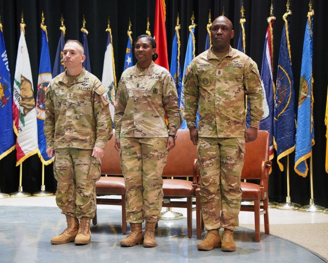 Maj. Gen. Michael B. Lalor, commanding general of TACOM, outgoing Command Sgt. Maj. Kendra St Helen and incoming Command Sgt. Major Kofie Primus at an April 2, 2025, Change of Responsibility ceremony.