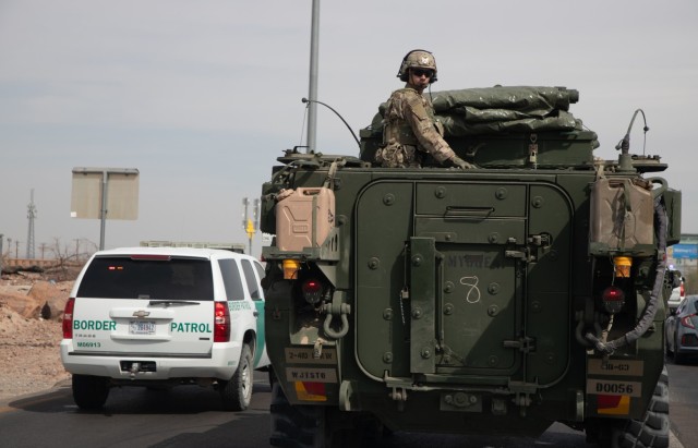 U.S. Army Sgt. Nathaniel Wedemeyer, assigned to the 1st Battalion, 41st Infantry Regiment, 2nd Stryker Brigade Combat Team, 4th Infantry Division, rides in a Stryker armored vehicle on Interstate 10 during a convoy to the southern border at El...