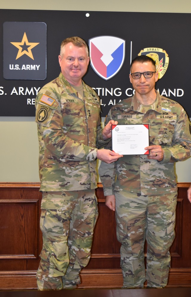 LTG Mohan, AMC commanding general, presented COL Isaac Torres, 414th Contracting Support Brigade commander, with his qualifications for the Master Combat Badge at the ACC Commander&#39;s Conference on April 4, 2025.
