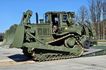 Polish servicemembers train on moving U.S. Army APS-2 heavy construction vehicles