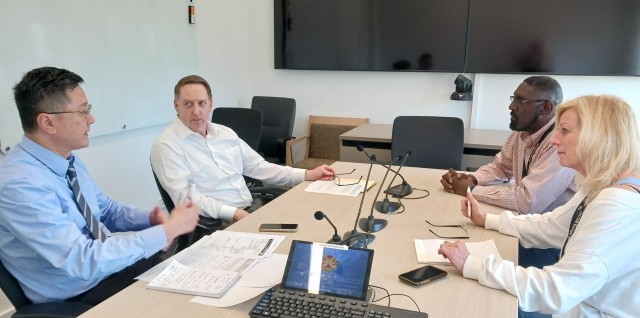 From left, auditors Kevin Liu and Bill Hemberger go over the lifecycle replacement plan program for information technology equipment with Louis Scott and Annemieke Anderson of the G6 Information Management Office.