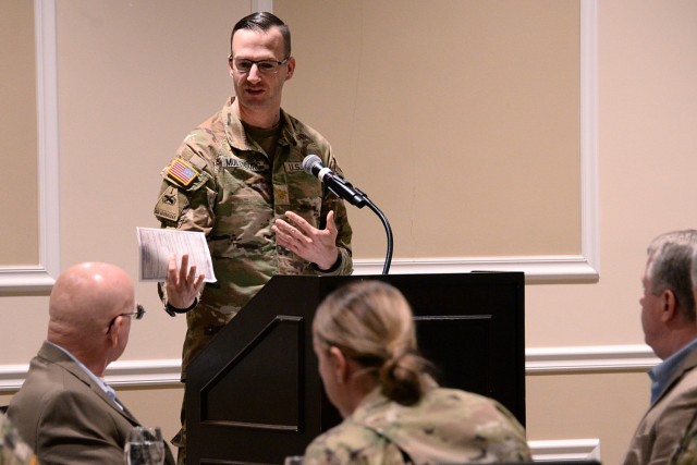 Chaplain (Maj.) Andrew Muilenburg, Command and General Staff College chaplain, introduces guest speaker retired Maj. Gen. Gregg Martin, author of "Bipolar General: My Forever War with Mental Illness," during the Fort Leavenworth National Prayer...