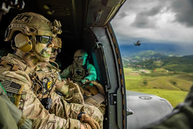U.S. Army Soldiers assigned to 1st Battalion, 54th Security Force Assistance Brigade conduct a security operation during Southern Vanguard 22 in Lorena, Brazil, Dec. 7, 2021, within the U.S. Southern Command area of operations. Key Management...