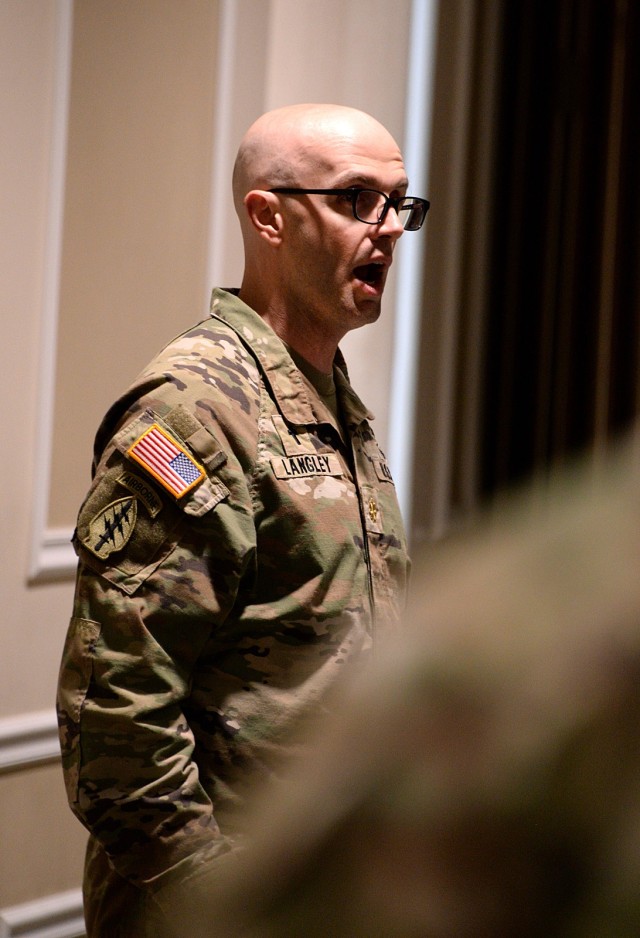 Chaplain (Maj.) Adam Langley, Command and General Staff College student, performs the national anthem as the Fort Leavenworth National Prayer Luncheon begins April 3, 2025, at the Frontier Conference Center at Fort Leavenworth, Kansas. Photo by...