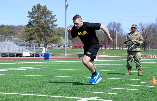 Capt. Gregory Mathieson, Command and General Staff College student, sprints through the 11x10-meter portion of the German Armed Forces Proficiency Badge fitness test while Sgt. 1st Class Joshua Hayes, Kansas City Recruiting Battalion, evaluates...
