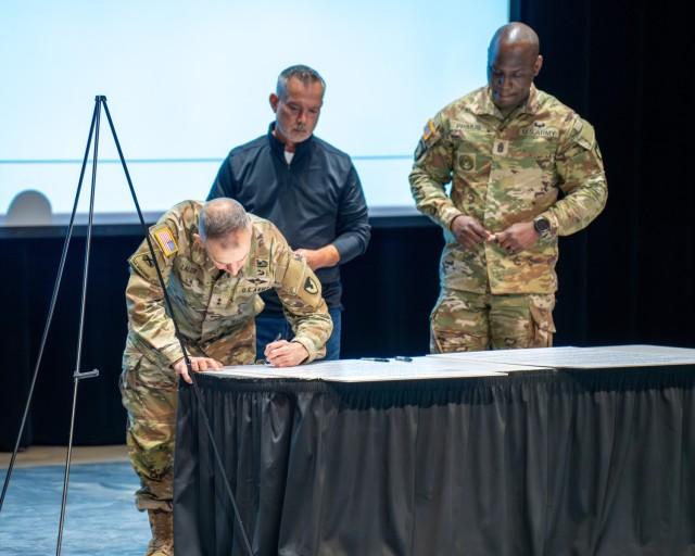 Maj. Gen. Michael B. Lalor, commanding general of TACOM, Deputy to the Commander Brian Butler and Command Sgt. Maj. Kofie Primus at the April 7, 2025, SAAPM kickoff event at the Detroit Arsenal.