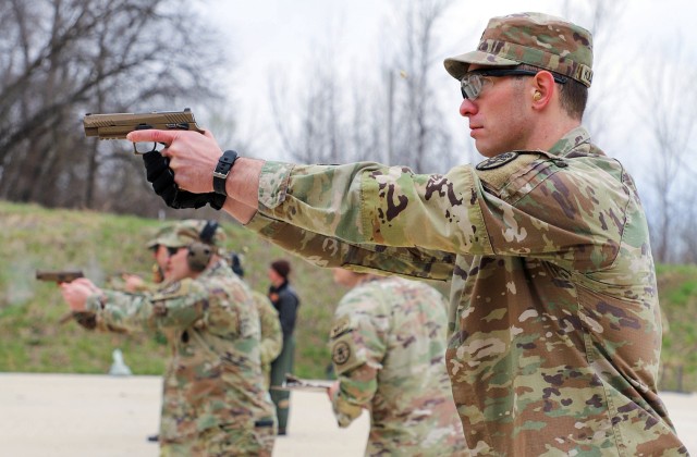 Spc. Joshua Kuliszewski, Medical Department Activity, conducts the pistol marksmanship portion of the German Armed Forces Proficiency Badge event April 1, 2025, at Kinder Range at Fort Leavenworth, Kansas. Participants engaged targets with the M17...