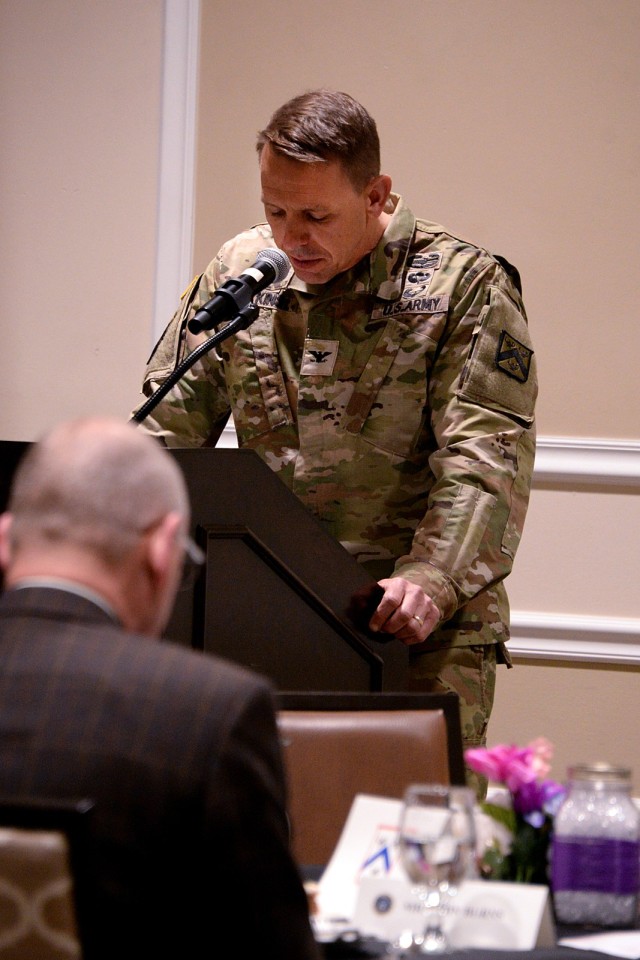 Chaplain (Col.) Matt Atkins, Mission Command Training Program religious support observer, coach/trainer chaplain, delivers a prayer for the military and families during the Fort Leavenworth National Prayer Luncheon April 3, 2025, at the Frontier...
