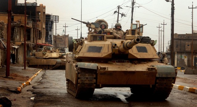 TALL AFAR, Iraq - U.S. Army M1 Abrams tanks maneuver in the streets as they conduct a combat patrol in the city of Tall Afar, Iraq, on Feb. 3, 2005. The tanks and their crews are attached to the 3rd Armored Cavalry Regiment. DoD photo By Staff...