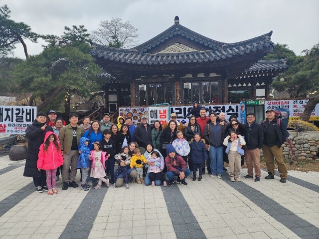 Community members from K-16 pose outside of Namhansansung, a UNESCO World Heritage Site fortress in Gwangju, as part of a cultural tour, March 29, 2025. ...