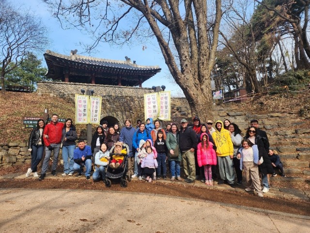 Community members from K-16 pose outside of Namhansansung, a UNESCO World Heritage Site fortress in Gwangju, as part of a cultural tour, March 29, 2025. ...