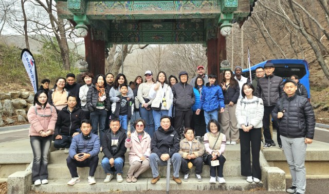 Community members from Camp Humphreys pose outside of Gwangdeoksa Temple as part of a cultural tour, March 29, 2025. ...