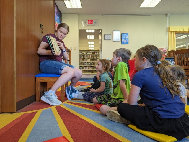 Maribel Sikes hosts a story time for children at Camp Zama, Japan. Sikes, the daughter of Lt. Col. Nick Sikes, is the 2025 Operation Homefront Military Child of the Year.