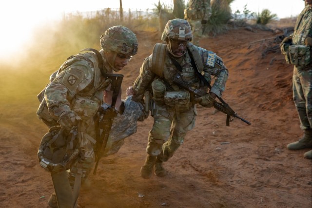Soldiers compete in a casualty evacuation exercise during the Gen. Omar N. Bradley Best Observer, Coach/Trainer Competition