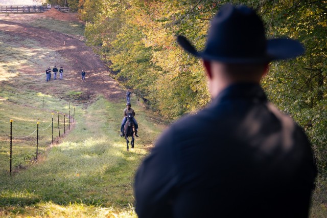 A Caisson instructor looks on as Soldiers assigned to the U.S. Army Caisson Detachment, 3d U.S. Infantry Regiment “The Old Guard” conduct training at Tamarack Stables in Lorton, Va. on Oct. 23, 2024. The training is a part of the Caisson...