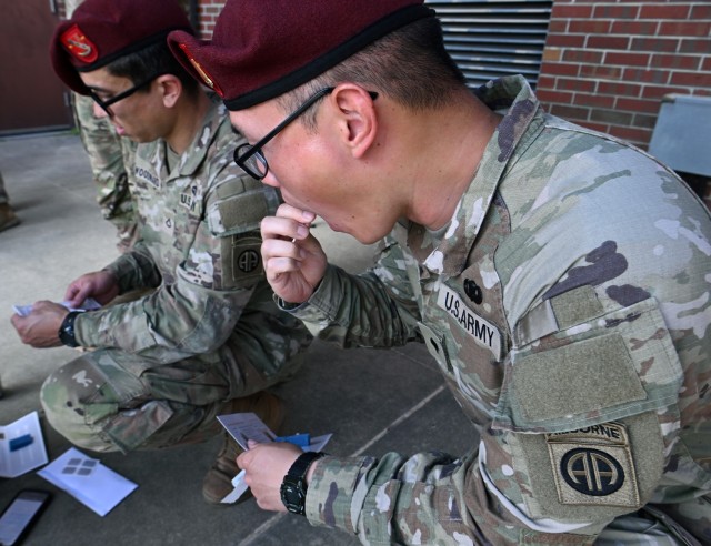 A Soldier from the 82nd Airborne Division swabs his cheek during a bone marrow screening facilitated by members of the Joint Special Operations Medical Training Center, under the U.S. Army John F. Kennedy Special Warfare Center and School, at Fort...