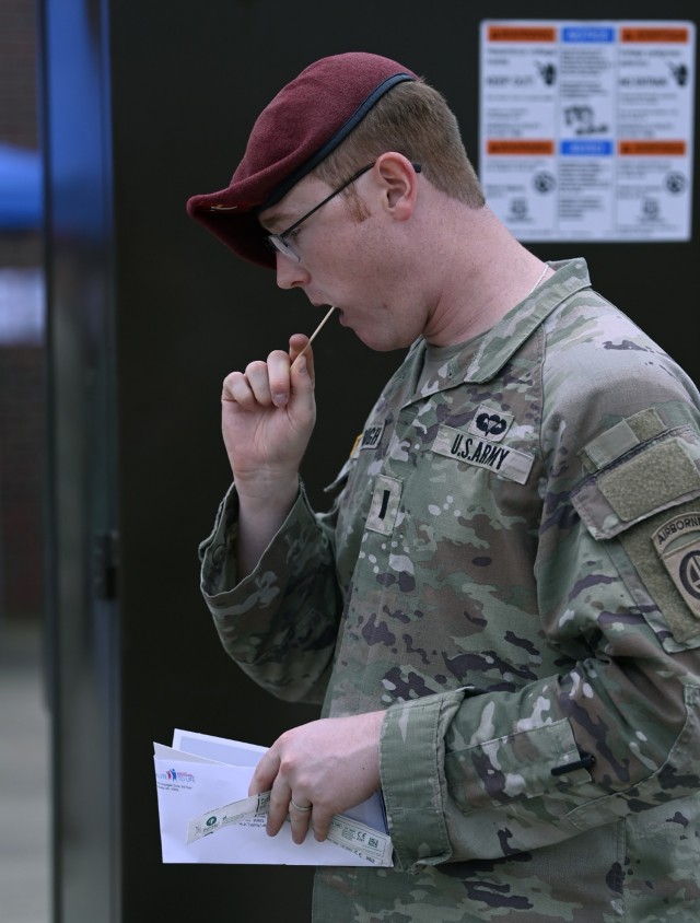 A Soldier from the 82nd Airborne Division swabs his cheek during a bone marrow screening facilitated by members of the Joint Special Operations Medical Training Center, under the U.S. Army John F. Kennedy Special Warfare Center and School, at Fort...