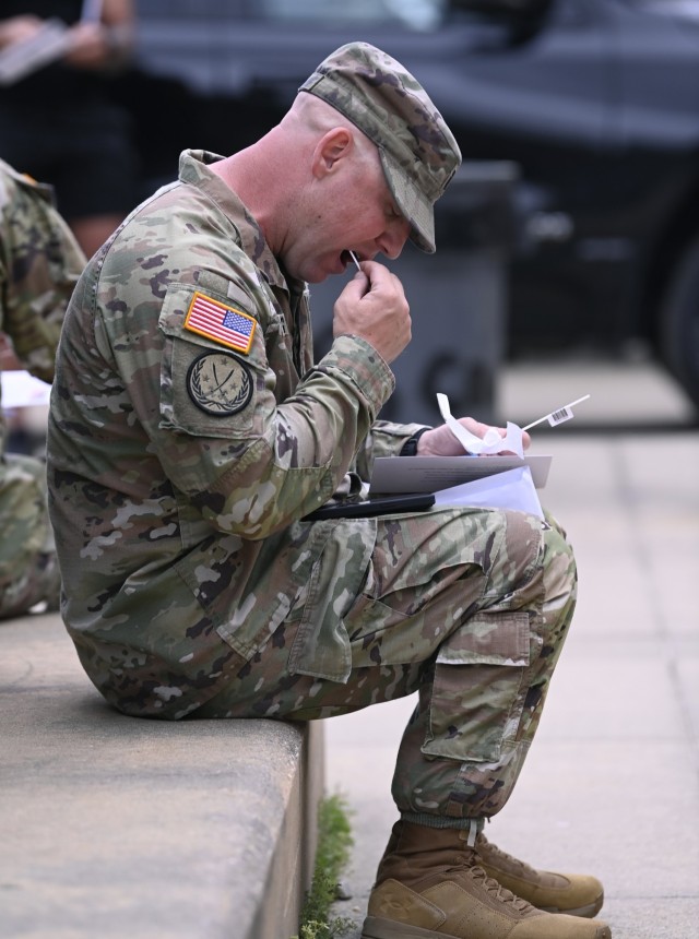 A Soldier from the 82nd Airborne Division swabs his cheek during a bone marrow screening facilitated by members of the Joint Special Operations Medical Training Center, under the U.S. Army John F. Kennedy Special Warfare Center and School, at Fort...