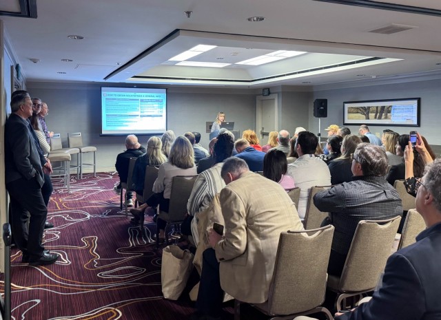 U.S. Army Corps of Engineers Sacramento District team member, Nikole May speaks during a breakout session about current opportunities at the annual Business Opportunity Open House hosted by the small business section at the Hyatt Regency in...
