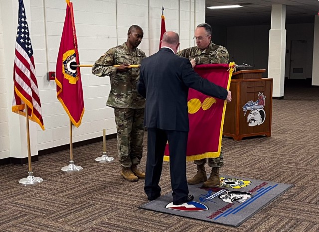 Brig. Gen. Ronnie Anderson Jr. (right), the Joint Munitions Command’s commander, Tom Nowell, the Milan Army Ammunition Plant’s commander’s representative, and Command Sgt. Maj. Christopher Reaves, JMC command sergeant major, secure the...