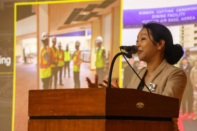 Senior leader in contracting speaking with audience.