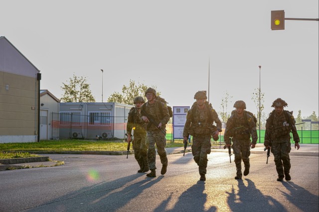 Soldiers conduct 12-mile ruck march at Best Squad Competition in Italy