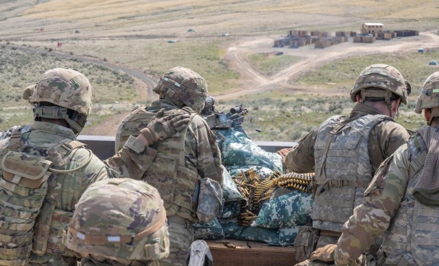 A weapons squad from 2nd Battalion, 162nd Infantry Regiment fires an M240 machine gun from a support-by-fire position during a blank-fire iteration at Yakima Training Center, Wash., April 5, 2025. The training exercise prepared the crew for...