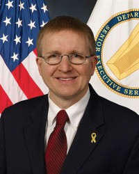 Dr. Patrick Baker, Director