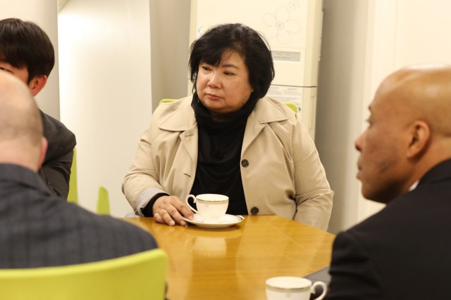 Senior leaders in contracting participating in tea ceremony.