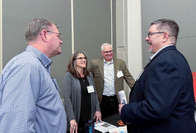 U.S. Army Corps of Engineers Sacramento District team members from the operations division speak with attendees at the annual Business Opportunity Open House hosted by the small business section at the Hyatt Regency in Sacramento, California on...