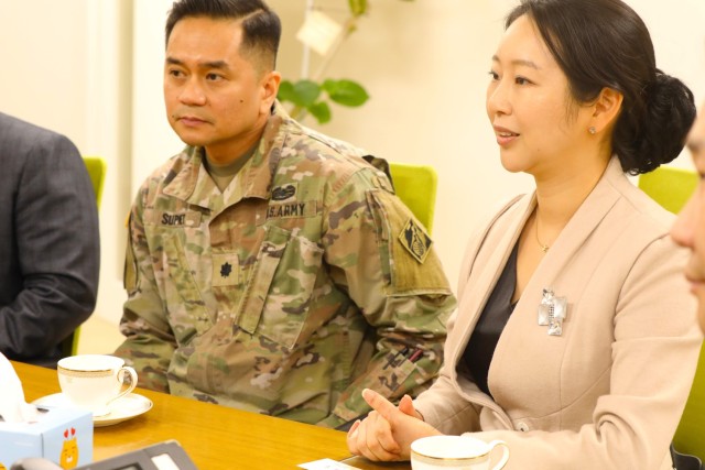 Senior leaders in contracting participating in tea ceremony.