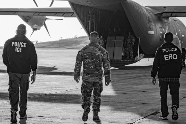 U.S. Service Members support interagency partners escorting illegal aliens as part of Operation Southern Guard at Naval Station Guantanamo Bay, Cuba, Feb. 8, 2025. Joint Task Force Southern Guard is supporting illegal aliens holding operations led...