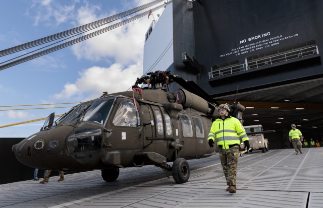 A U.S. Army Reserve Soldier guides a UH-60 Blackhawk helicopter off of the motor vessel GREEN OCEAN, as part of reception, staging and onward movement at the port of Kalundborg, Denmark, April 20, 2024....