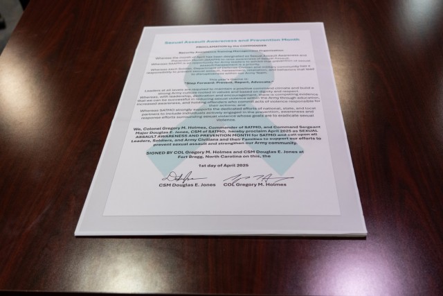 Col. Gregory Holmes and Command Sgt. Maj. Douglas Jones, the U.S. Army Security Assistance Training Management Organization command team, sign a proclamation declaring April as Sexual Assault Awareness and Prevention Month at Fort Bragg, N.C.,...