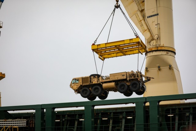 A M984A4 Heavy Expanded Mobility Tactical Truck (HEMTT) is loaded onto the Ocean Grand by crane, Dec. 7, at the Port of Setubal, Portugal. This mission was the first ever military operation conducted in Setubal and served to validate the port for...