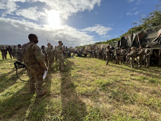 Member of the 225th LSB Red Cluster receiving a convoy brief from the convoy Commander CPT Abel Samuel, before jumping locations from Marine Corps Training Area Bellows (MCTAB), HI back to Schofield Barrack, HI, on June 13, 2024.