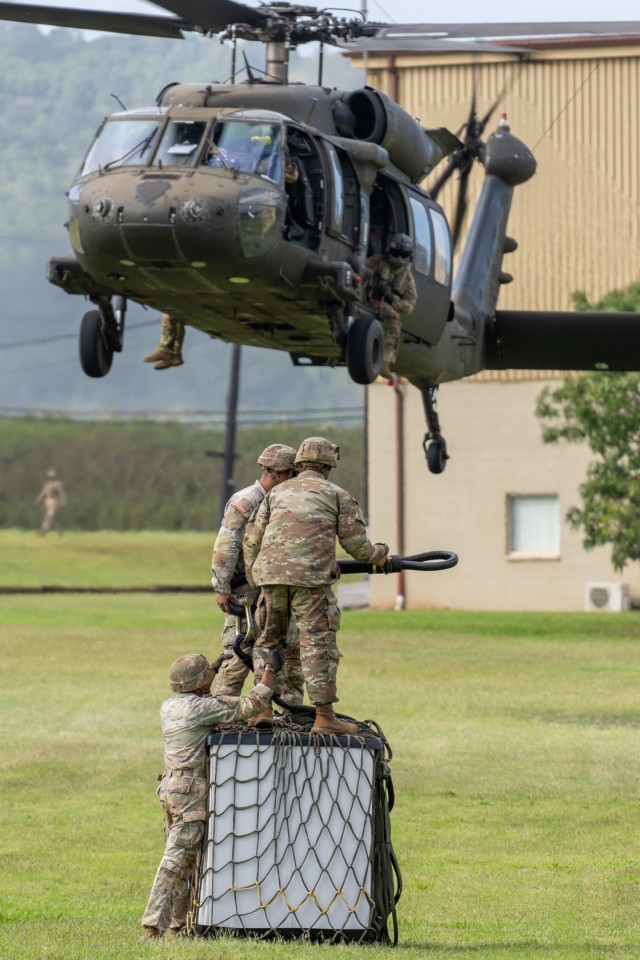 SPC Marvin Narvasa, SPC Larry Rudolph, SGT Carlos Martinez conduct sling load operations at Schofield Barracks, HI, Jan. 17, 2024.
