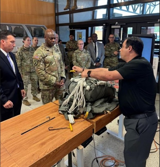 The Deputy Director of the ADRST Mr. Frank Badalucco giving a demonstration on smart table technologies being developed for the 92R field at the Aerial Delivery Field and Services Department.