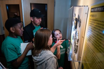 Teens immerse in military history while staying in Army museum for night of excitement, adventure