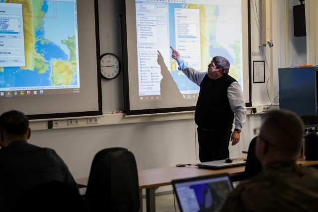 Mr. Alfonso Crencenzo, Logistics Functional Area Services (LOGFAS) subject matter expert, 21st Theater Sustainment Command, points at the screen to explain the capabilities within LOGFAS. LOGFAS is the NATO tool for logistics that integrates and...