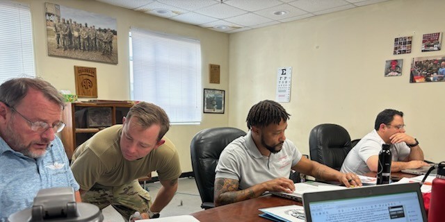 ADRST Data Analysts Lewis Mikulecky, Lance Walker, and ADRST Deputy Director Frank Badalucco give mentorship and guidance to WO1 Ames while assessing the 82nd Airborne Division, Delta Company, Fort Bragg, NC.
