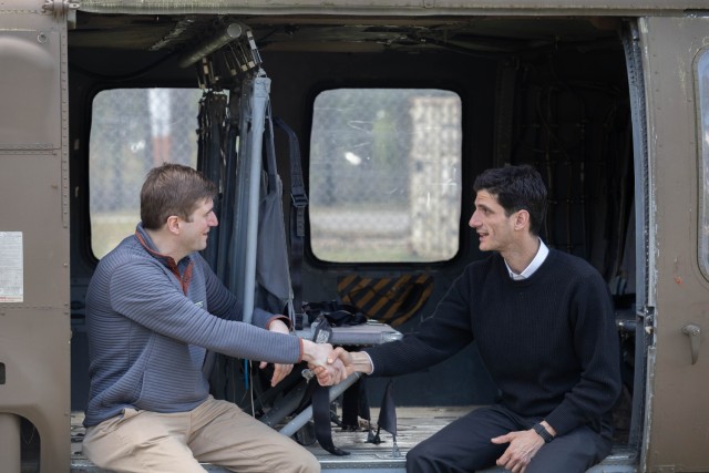 Jack B. Kennedy Schlossberg (right), President John F. Kennedy&#39;s grandson, and Michael Yarborough (left), Lt. Gen. William P. Yarborough&#39;s grandson, discuss the historic meeting of their grandfathers during their visit to Camp Mackall,...