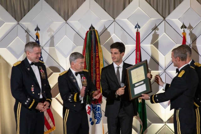 Jack B. Kennedy Schlossberg, President John F. Kennedy&#39;s grandson, prepares to present Gen. Brian P. Fenton, commanding general of U.S. Special Operations Command, with a page of Kennedy’s famous West Point speech in 1962 that included his...