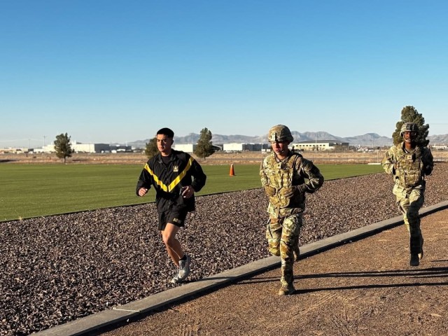 Spc. Collin W. Lewis (center)