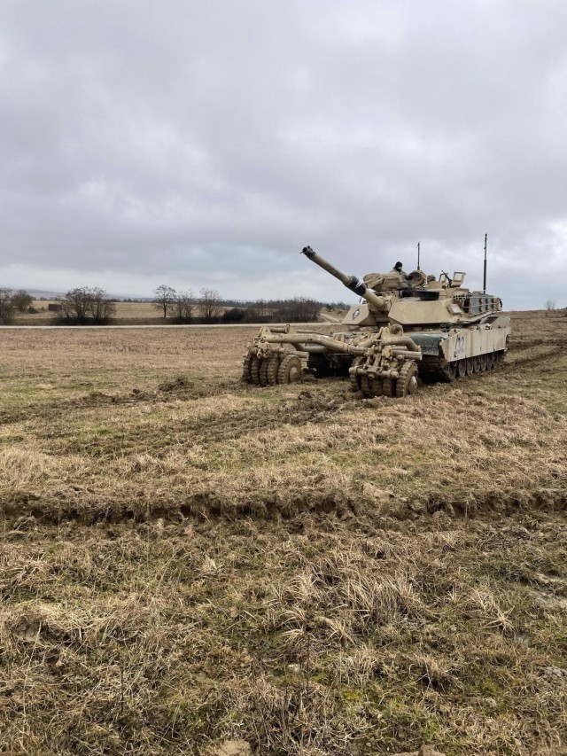 M1A2 Tank using the mine roller during an exercise.