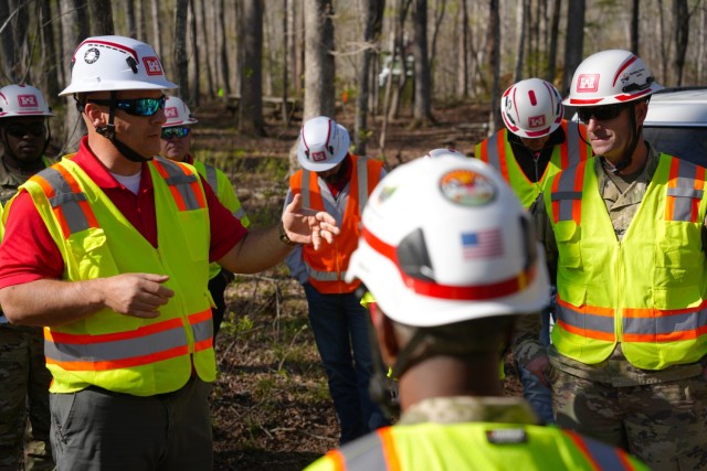 Mark Cardwell, U.S. Army Corps of Engineers private property debris removal mission manager (left), briefs USACE senior leadership on the progress being made in McDowell County, during a visit to a local boy scout camp receiving debris removal...